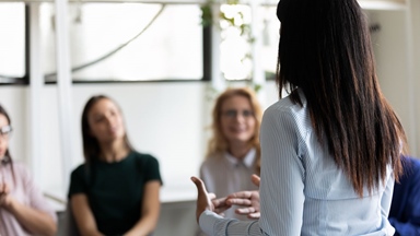woman-presenting-to-group